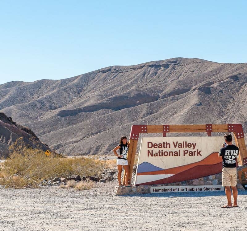 Tourists at the entrance to Death Valley National Park. Death Valley is the hottest place on earth