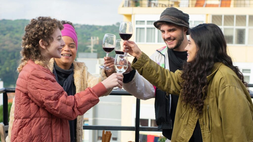People with wine glass Lisbon view