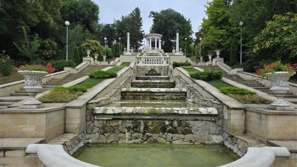 beautiful View of the cascade of fountains in the Valea Morilor park Chisinau Moldova. A serene fountain garden with cascading water in a public park during cloudy weather 