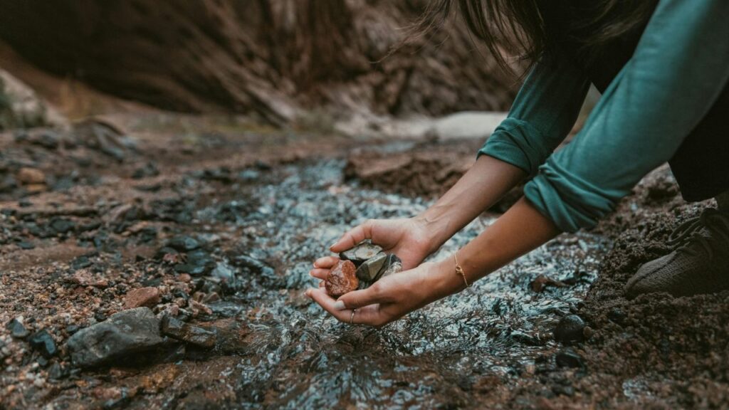 Hand picking rock in national park