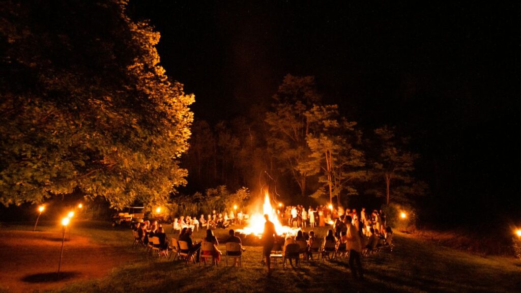 small Viking encampment people around fire