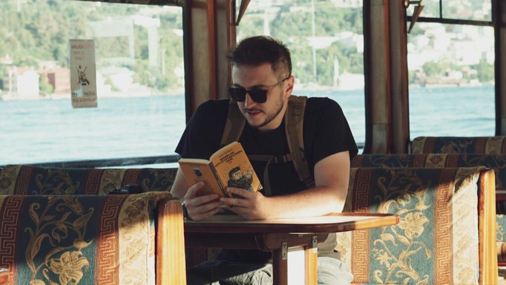 Traveler reading book on quiet cruise deck