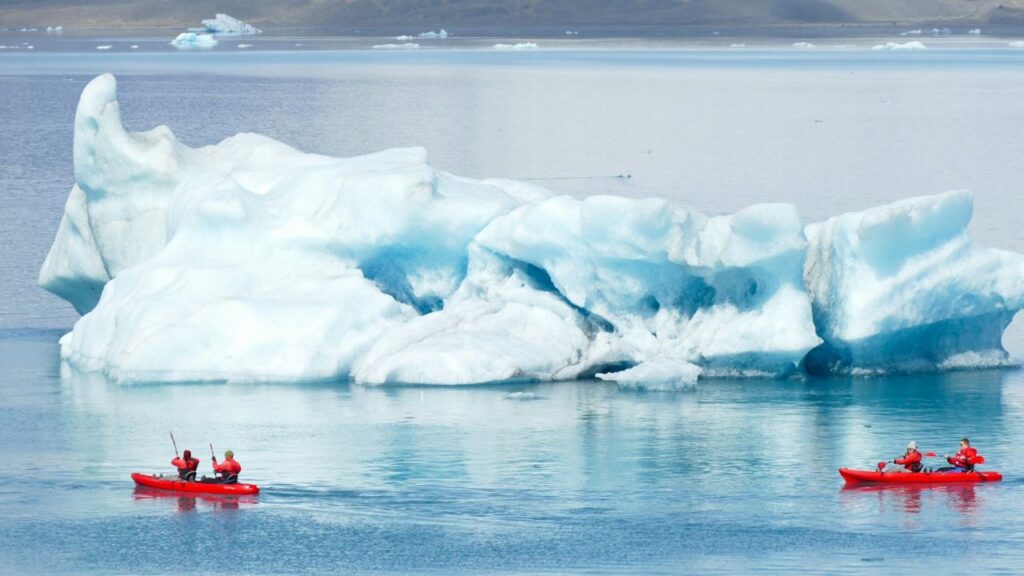 Kayaking near glacier from cruise ship
