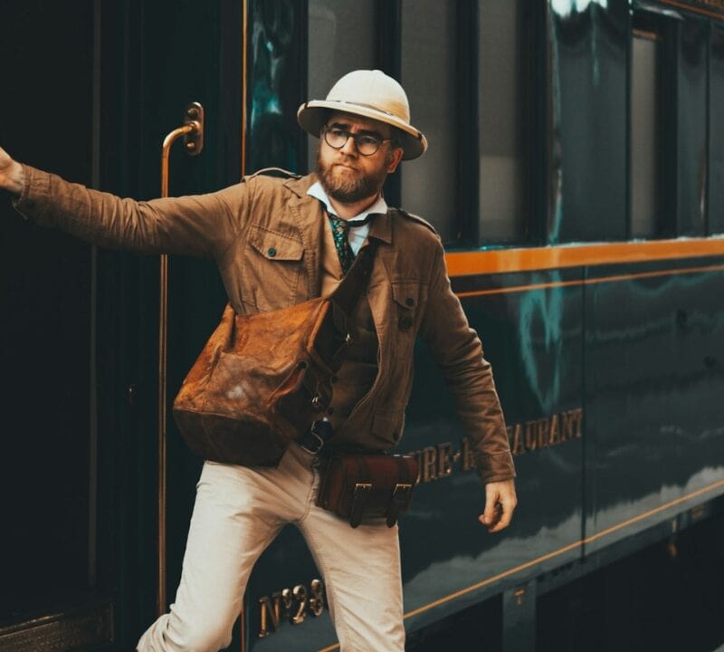 Vintage traveler getting out of the Orient Express train Lille, France