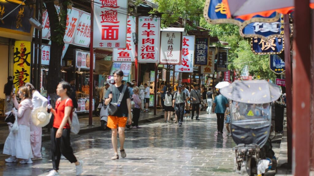 XI'AN, CHINA - JUNE 16, 2025: Crowded street in the Muslim Quarter of Xi'an, China