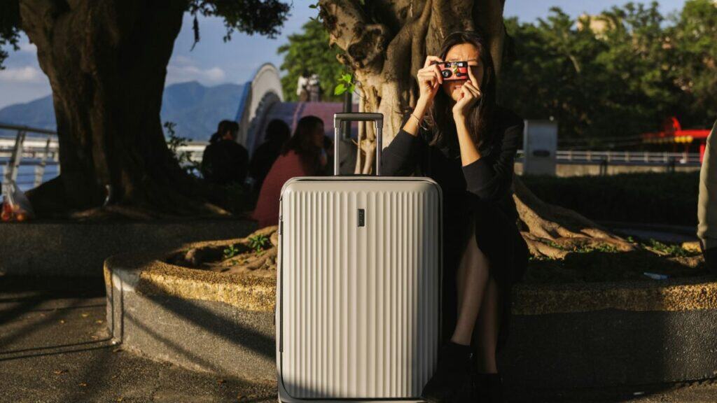 Women taking picture with flim roll camera
