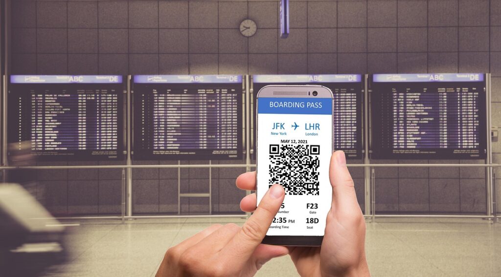 Traveler using phone boarding pass at airport