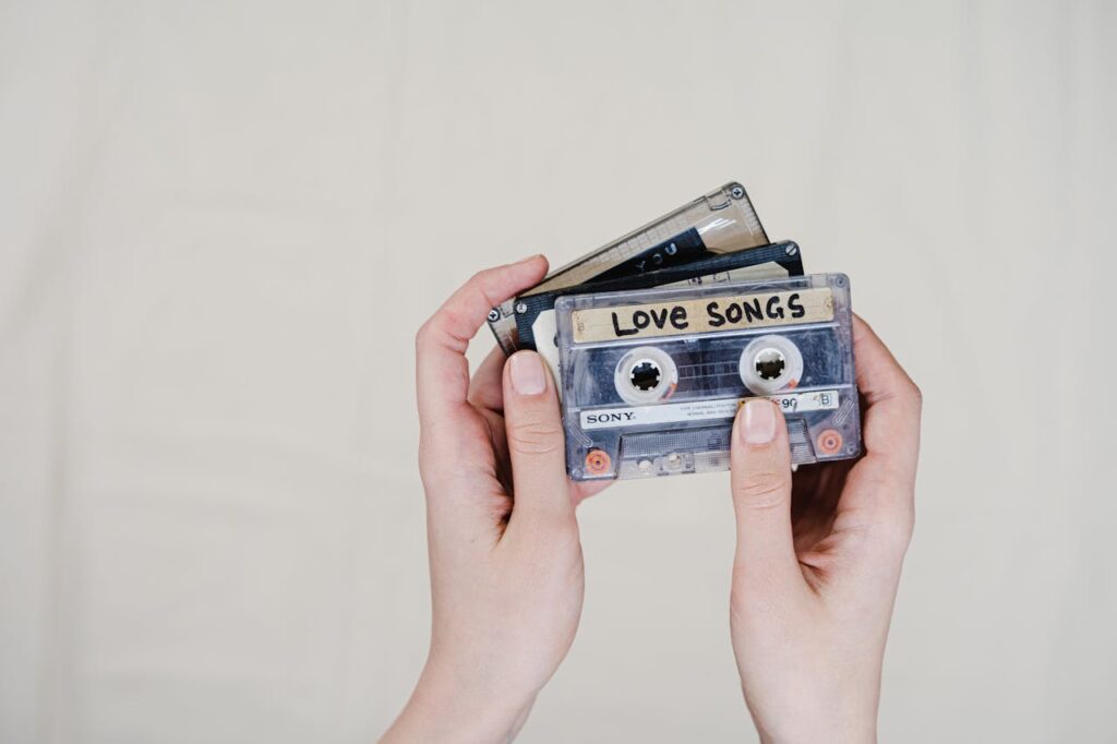 Hand holding mixtape cassette with handwritten label