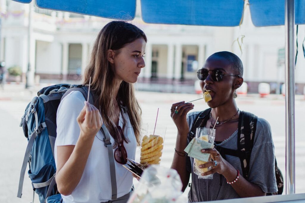 "Street food market with tourists eating