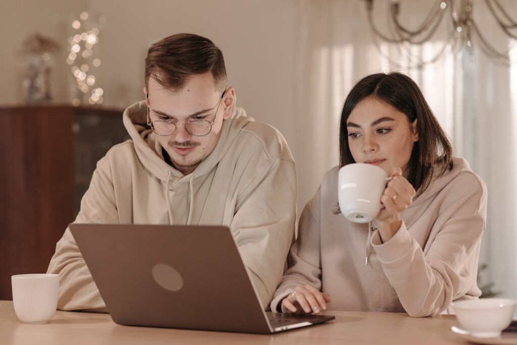 Traveler reading online forum comments laptop