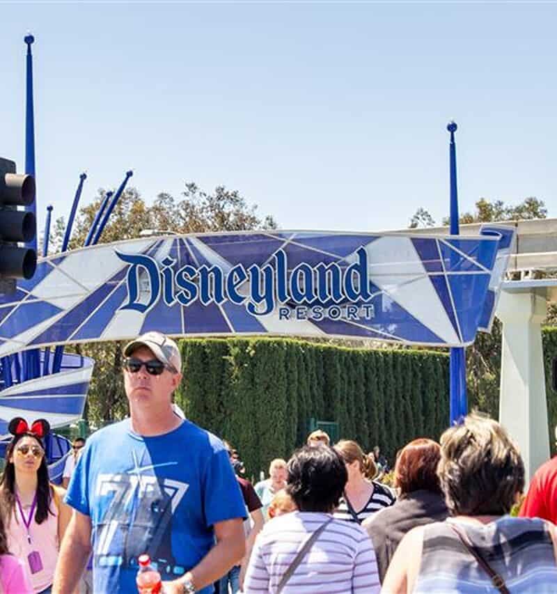 Anaheim, California/United States - 04/24/2019: Tourist walk across the street towards Disneyland theme park