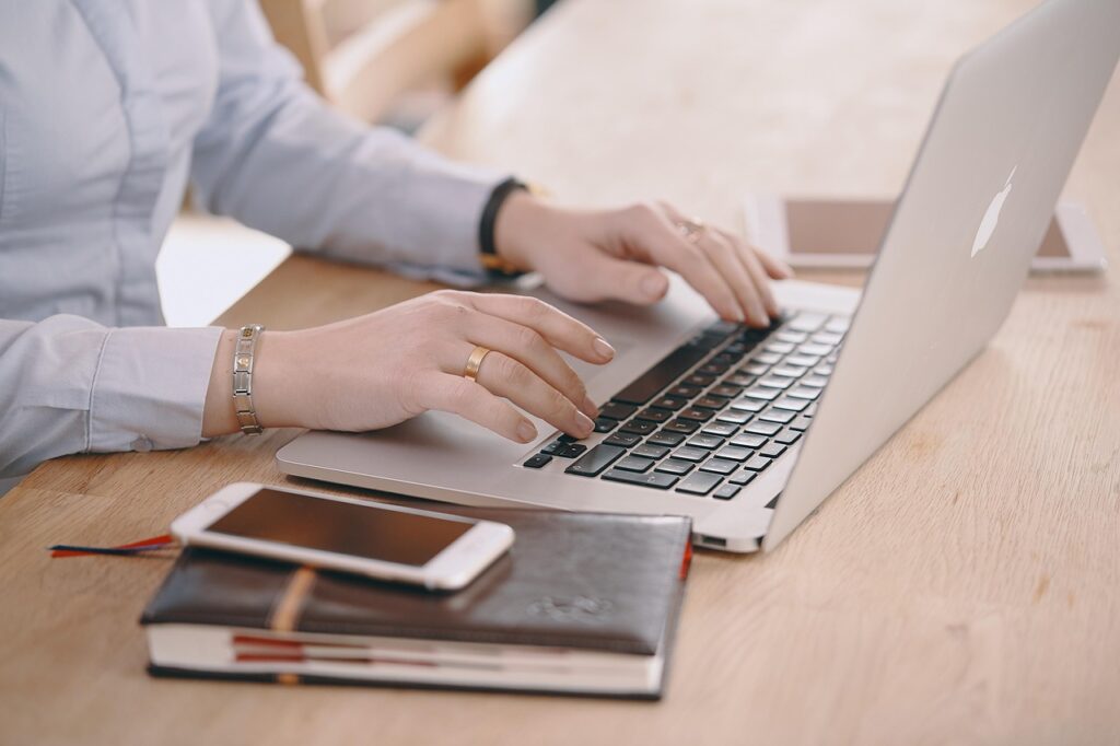 Traveler booking flight on laptop Expedia