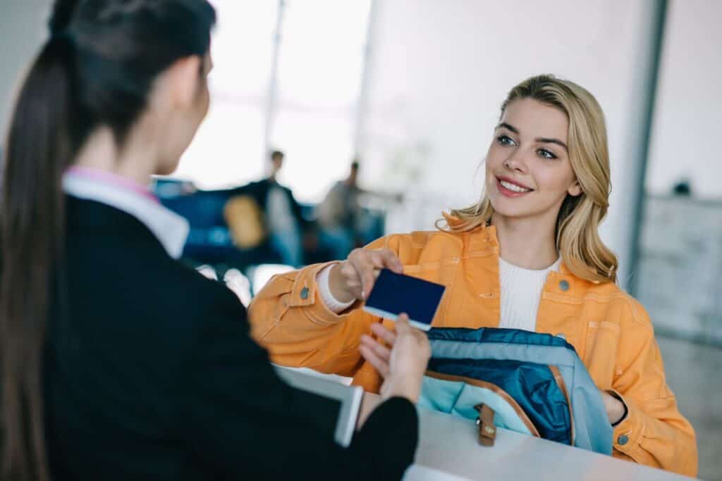 person at airport check in counter