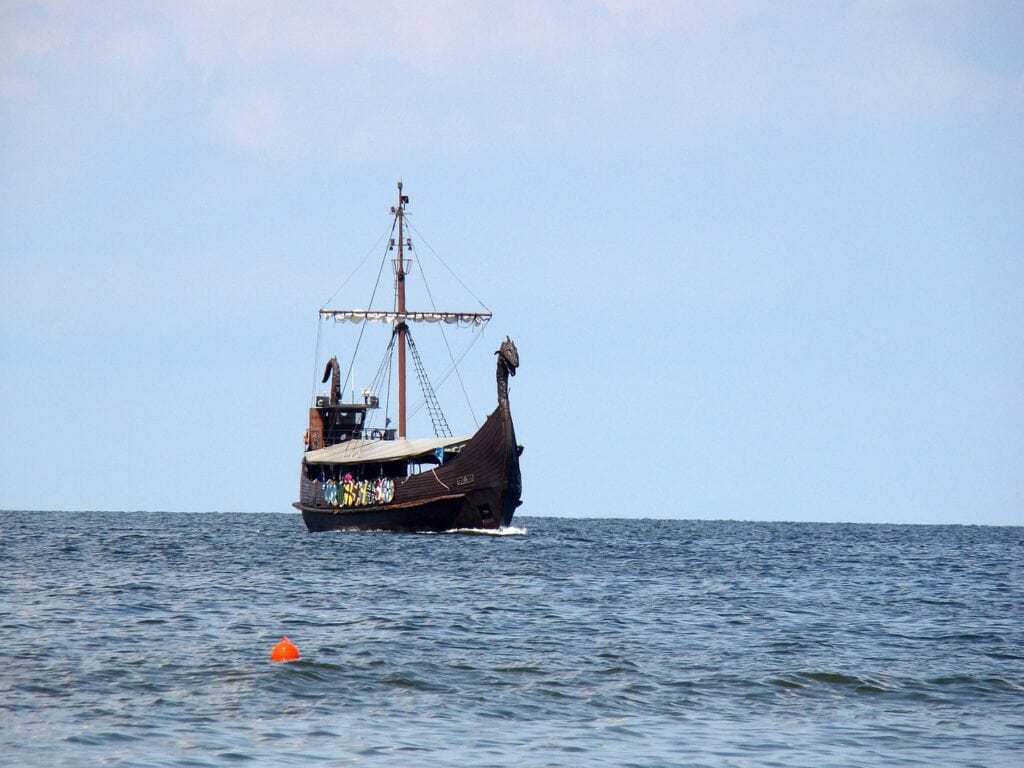 A Viking-inspired ship sailing into open waters, echoing the voyages that reshaped history.