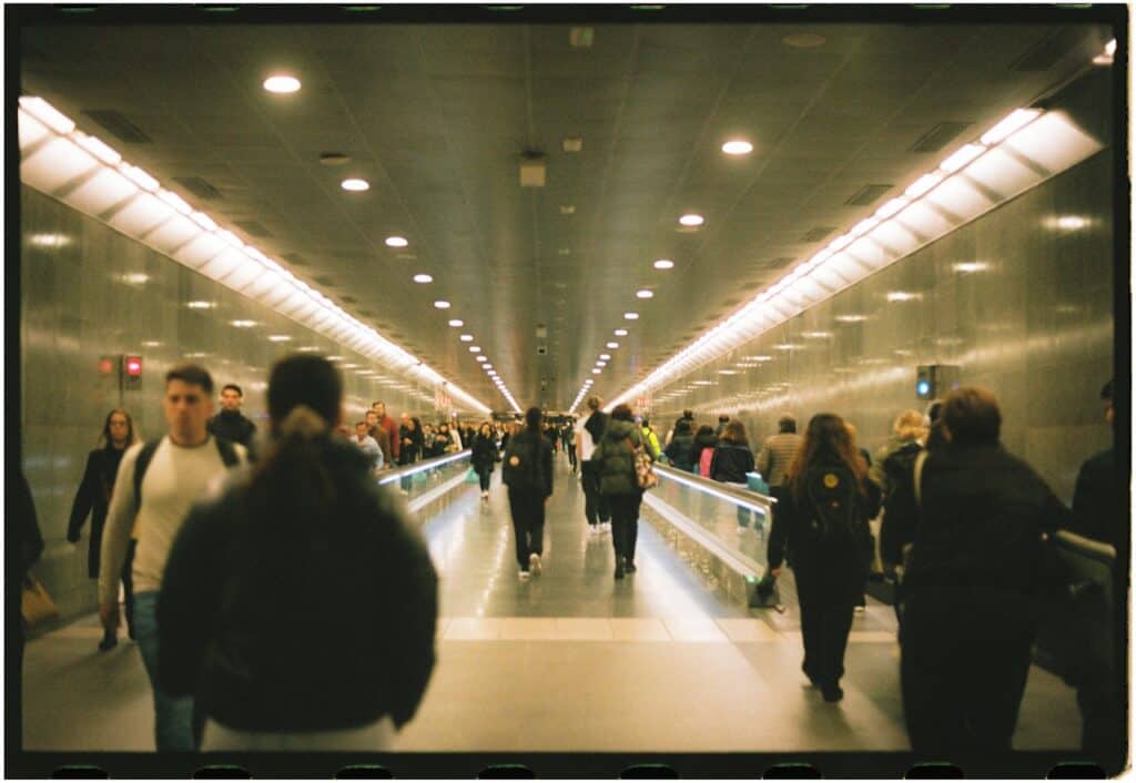 crowded airport travelers rushing