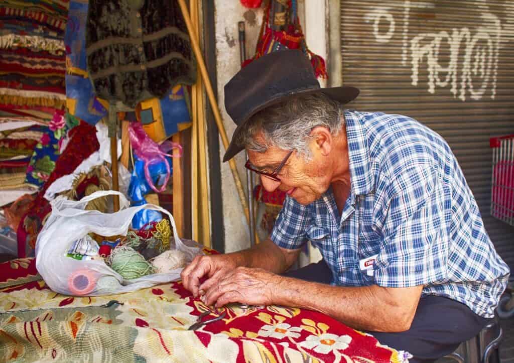 Artisan working by hand in a small local market