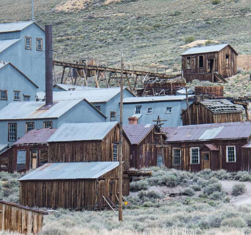 Buildings in the abandoned ghost town of Bodie California. Bodie was a busy, high elevation gold mining town in the Sierra Nevada Mountains in the early 1900s