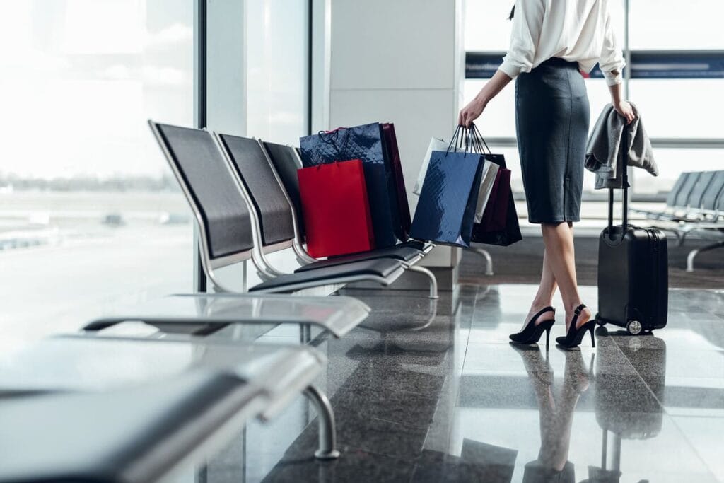 Duty-free shopping bags with alcohol and perfume bottles