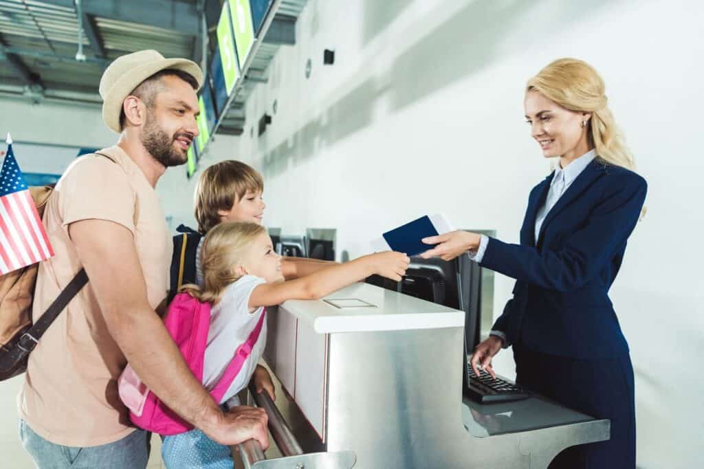 Family presenting passports and boar