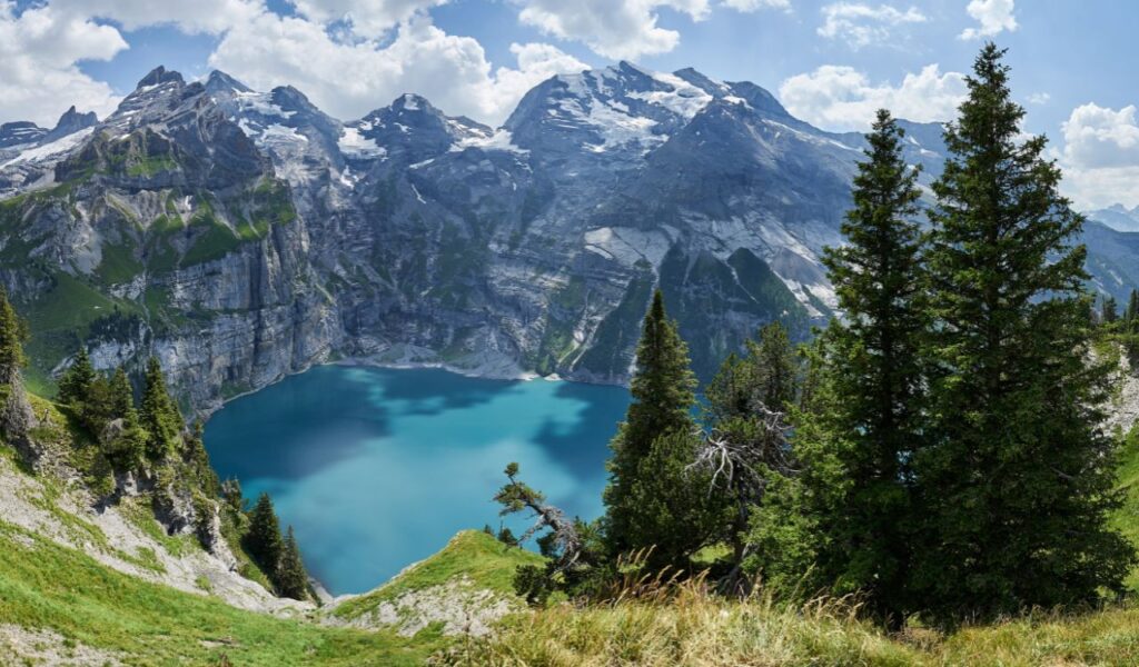 Panoramic view of Oeschinensee with Blüemlisalp, Fründenhorn and Doldenhorn (from Heuberg) Lake Oeschinen, Kandersteg (Switzerland)