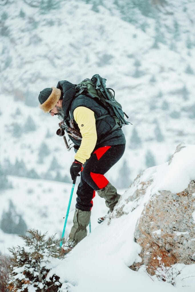 Shot of a hiker ascending a slope with a full backpack, f