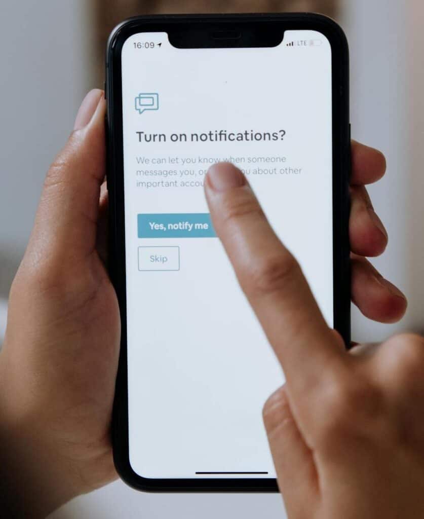 Smartphone with flight alert notifications.