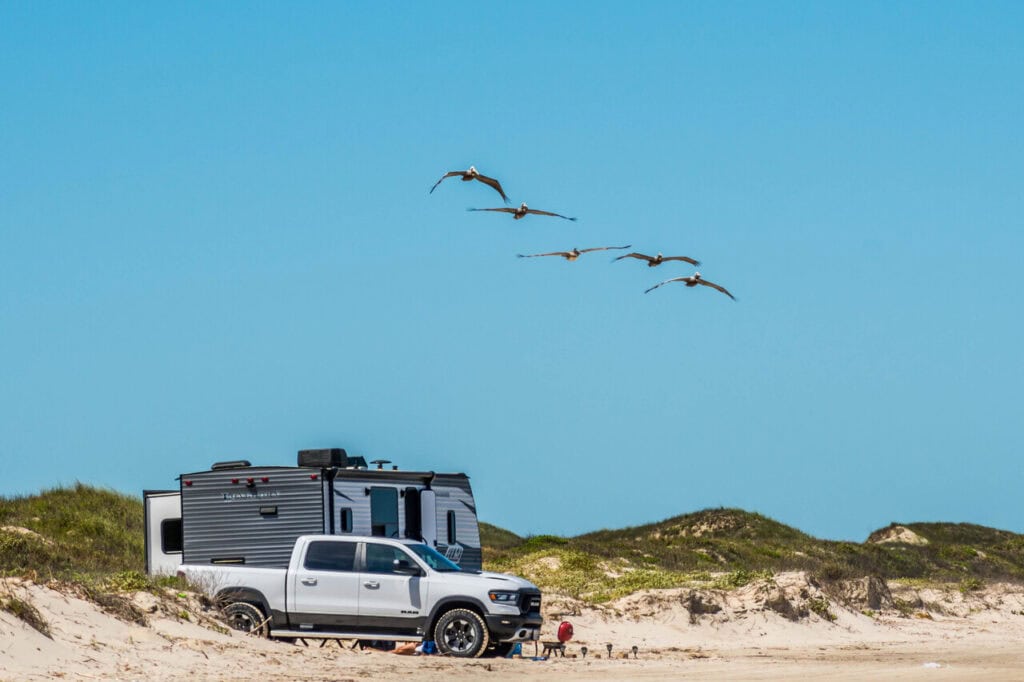 Padre Island NS, TX, USA - April 20, 2019: The F350 Ford with a trailer parked along the preserved island