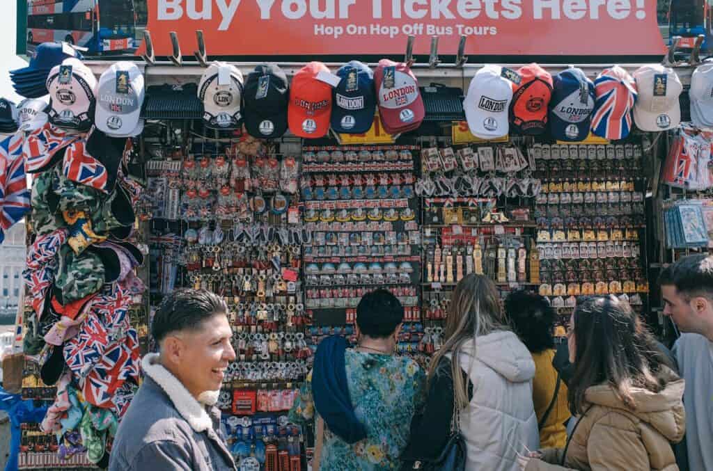 Tourists Looking at Stall with Souvenirs