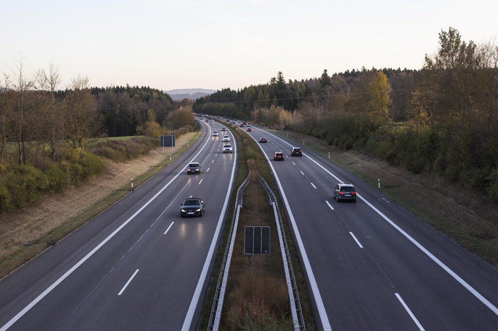 Two cars driving with ample space between them