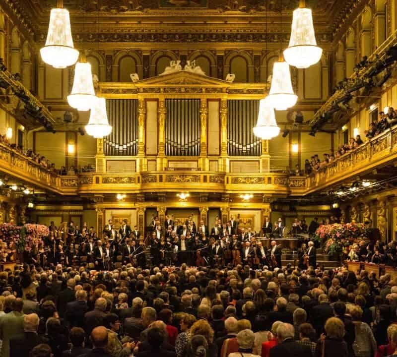 Grand concert hall interior in Europe with warm golden lighting,