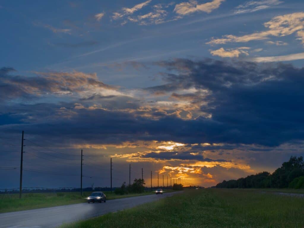 cars on road during sunset