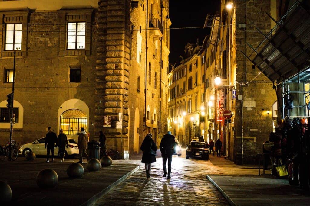 “couple walking on quiet evening street with lights