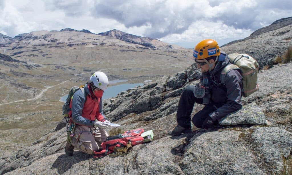 hikers discussing with map or GPS 