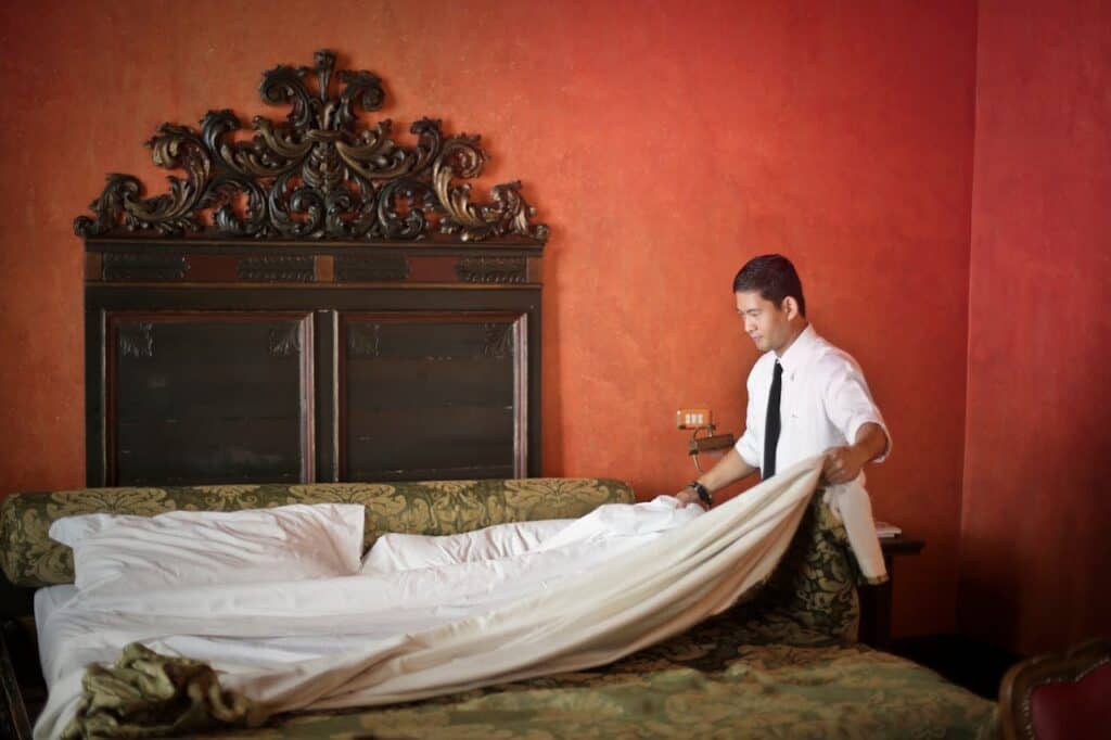 housekeeper cleaning a room