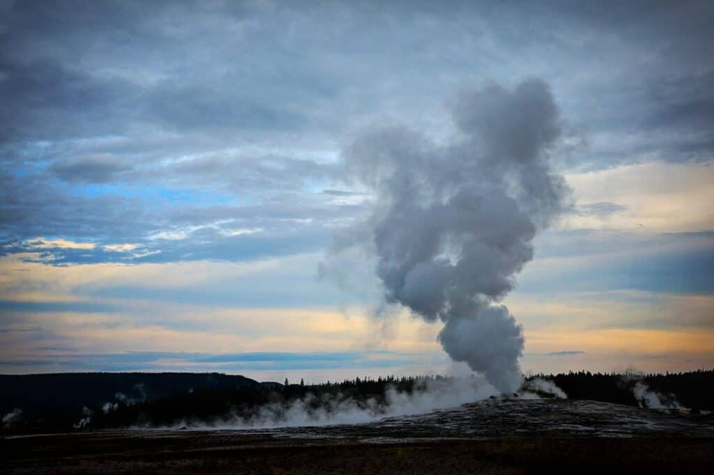 Old Faithful eruption sunset Yellowstone