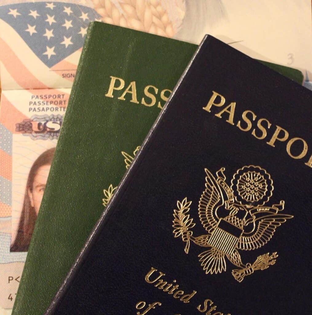 Flat lay of a U.S. passport, passport card,