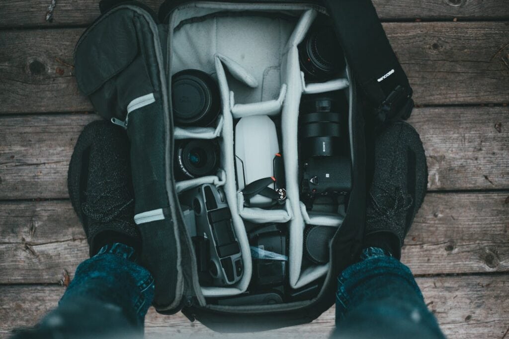 Backpack open with electronics neatly packed at the top