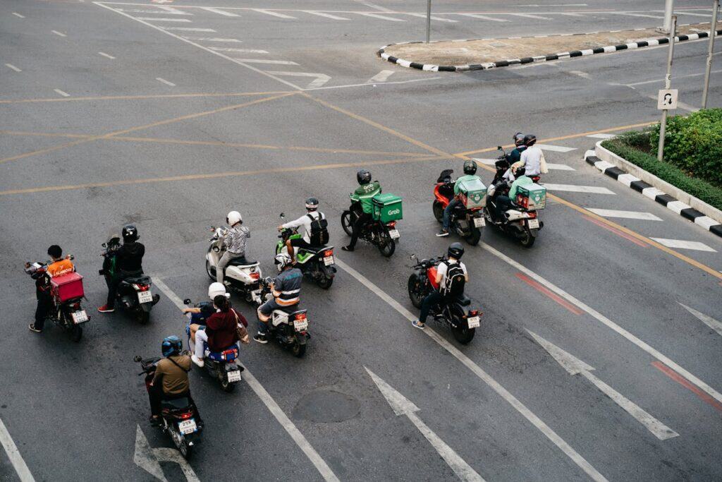 Close-up shot of a motorcycle at an intersection with visible pavement sensors.