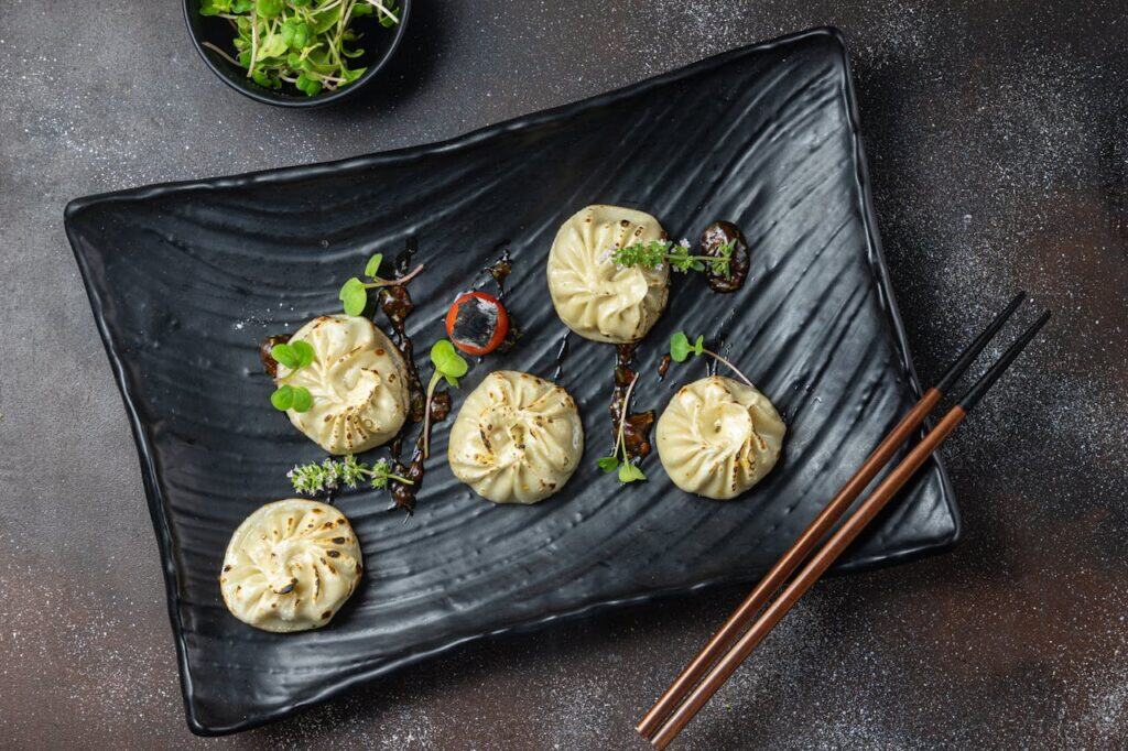 Momo Dish on a Black Plate