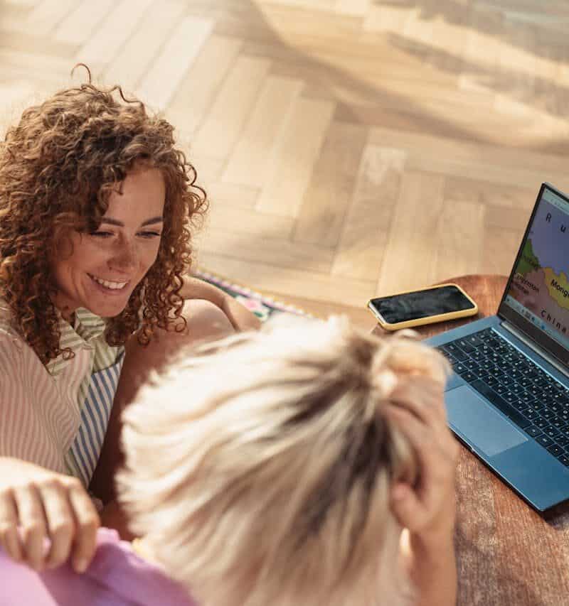 “Family planning vacation on laptop with map