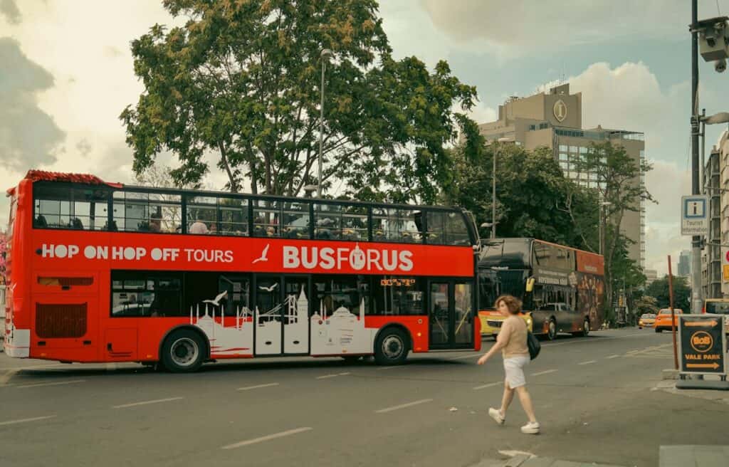 hop on hop off sightseeing bus in traffic jam city”
