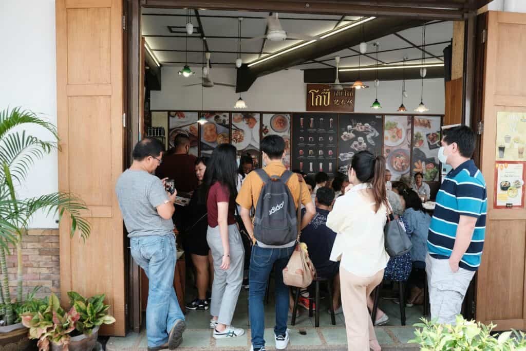 people standing in line at coffee shop