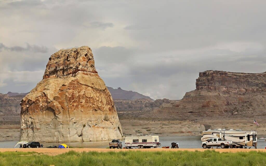 RV parked at a scenic overlook during sunset