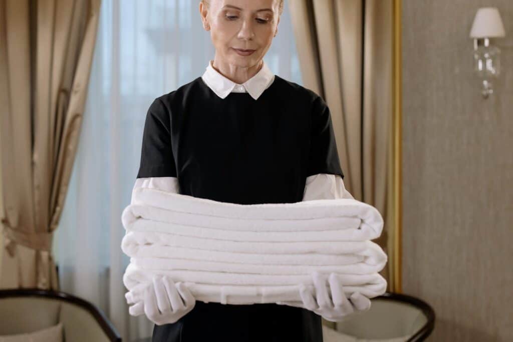 staff delivering cleaned clothes,