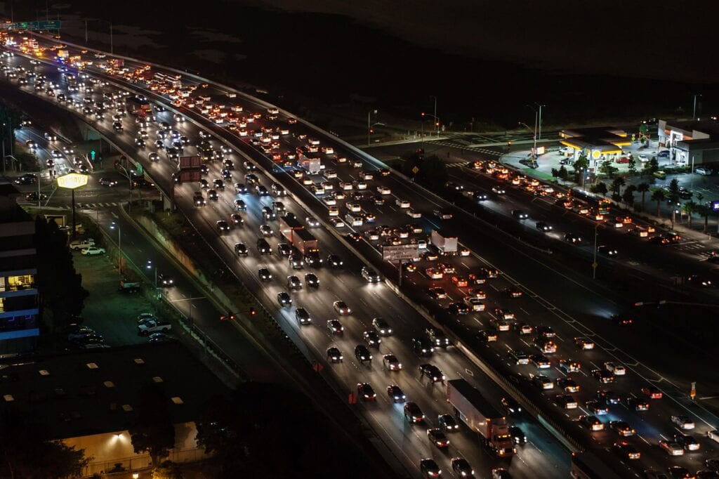 Overhead highway shot showing dangerously tight spacing between vehicles