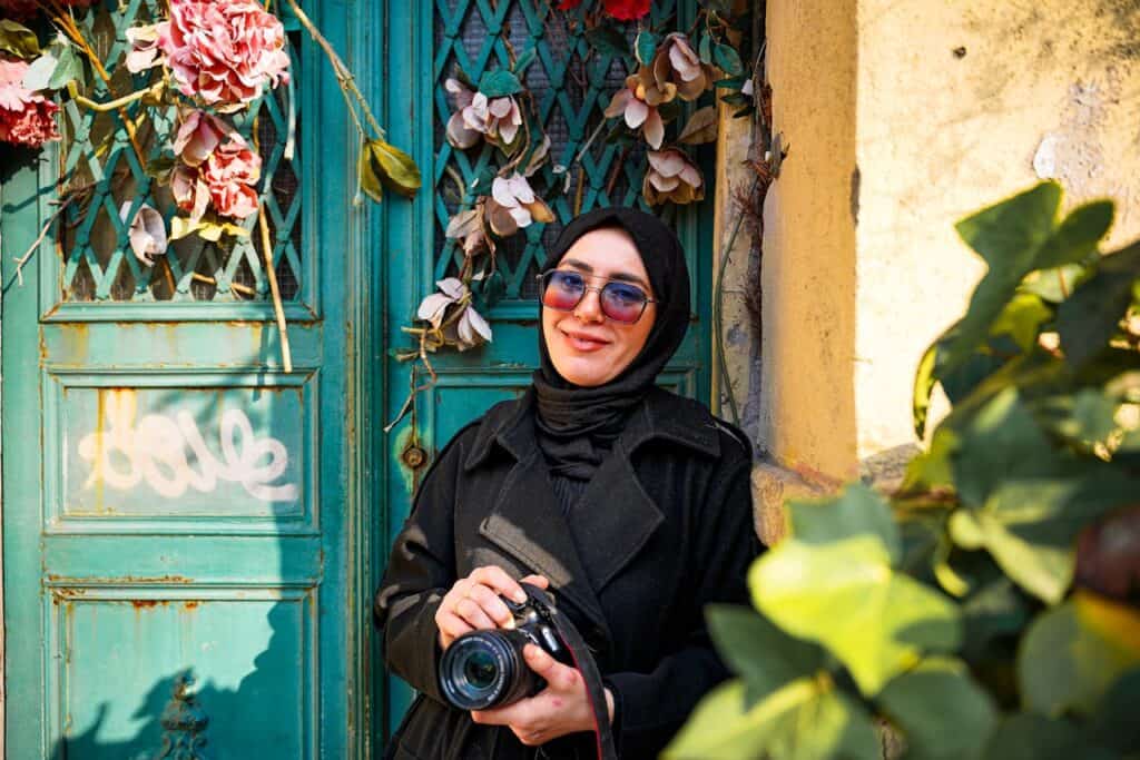 traveler covering shoulders with scarf