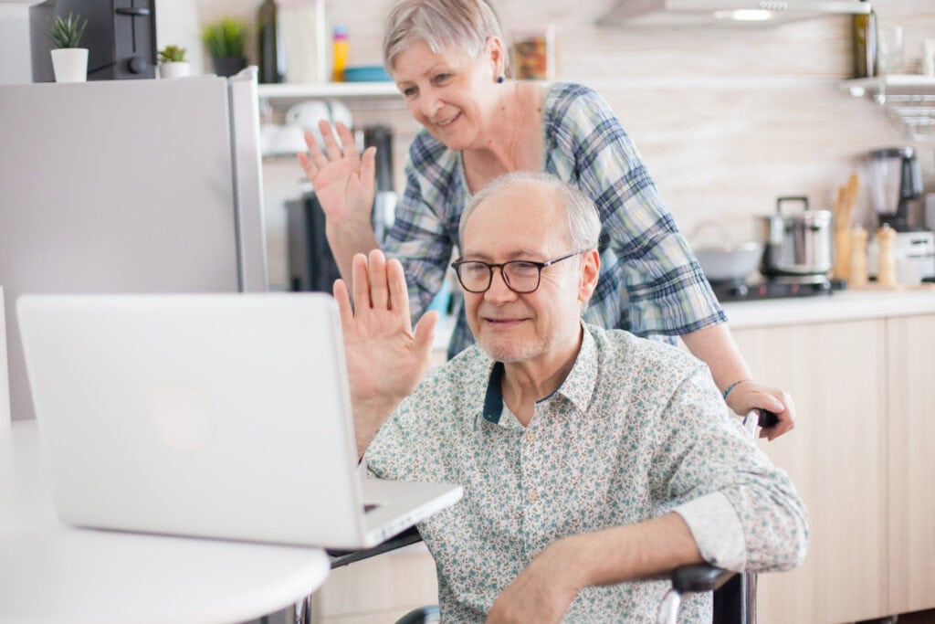 grandparent waving on video call