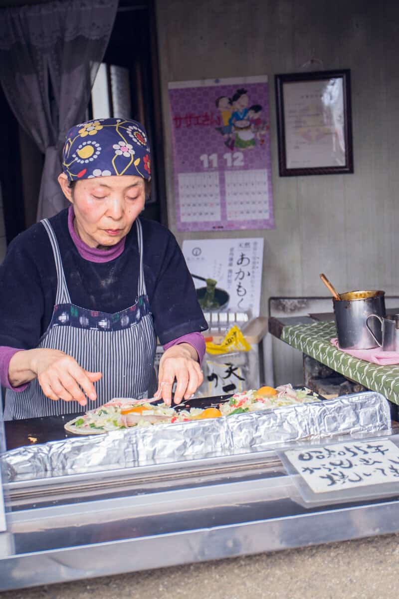 randmother cooking food at Imadegawa street, Kyoto, Japan.