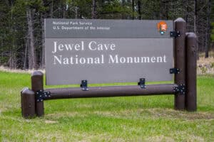 Jewel Cave NM, SD, USA - May 19, 2019: A welcoming signboard at the entry point of preserve park