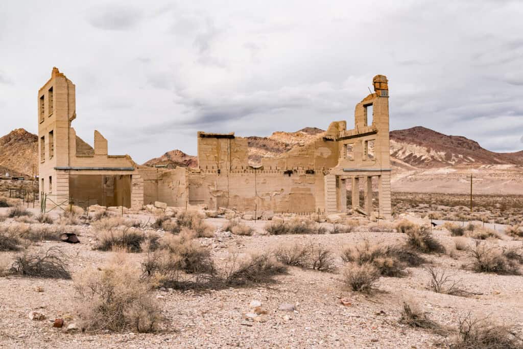 Ghost town ruins of abandoned buildings in the old boom town of Rhyolite, Nevada